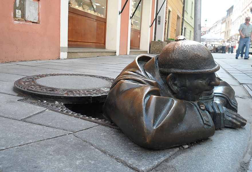 Man At Work "The Peeper" In Bratislava, Slovakia